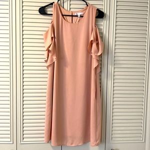 Pale pink, mid length, peek a boo shoulder dress with ruffle details and pockets